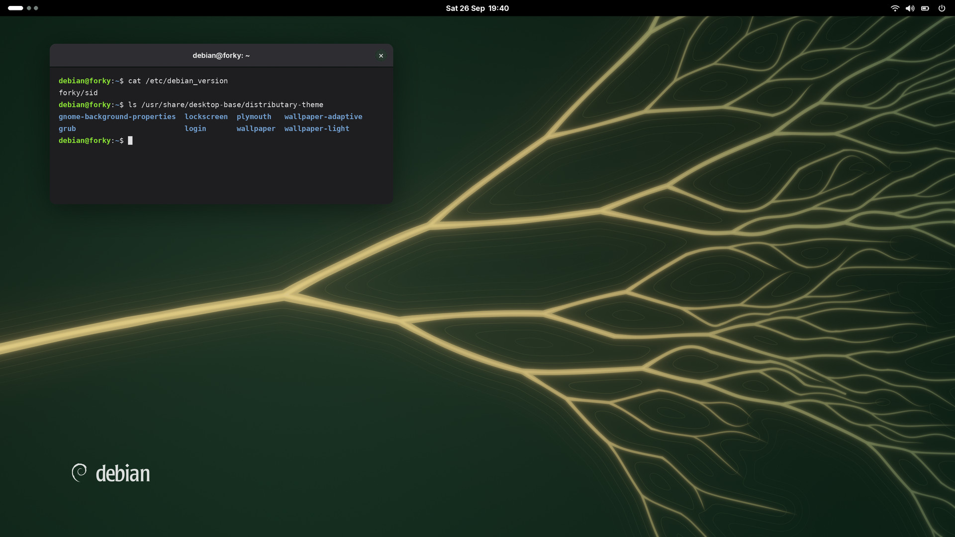 GNOME desktop with the dark wallpaper and a terminal window listing the theme's files.